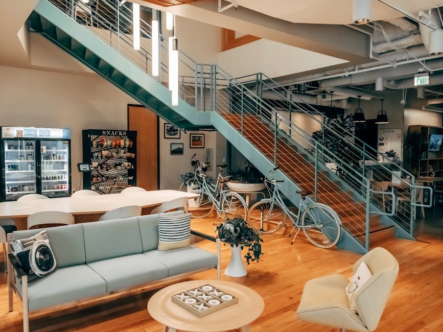 Bright and modern open office space featuring bikes, cozy seating, and stylish interior design elements