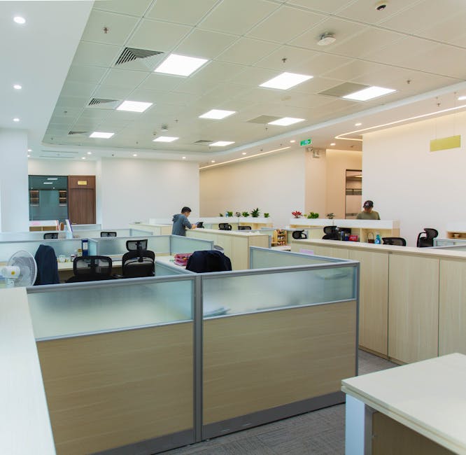 Spacious modern open office with workstations and natural lighting, optimal for productivity