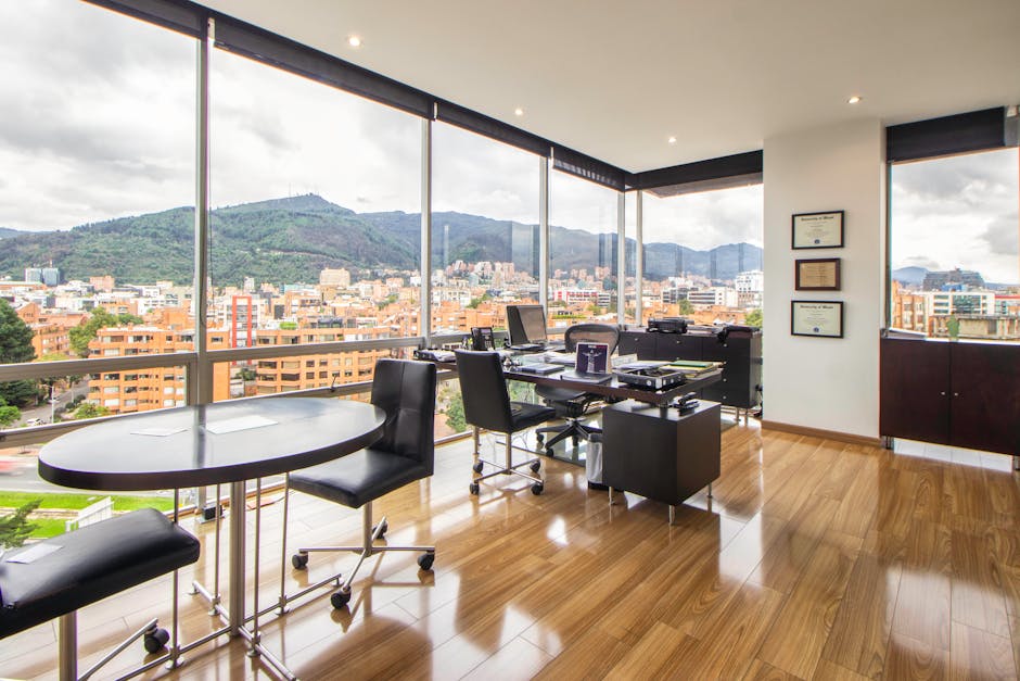 Spacious modern office with a scenic city view through glass windows